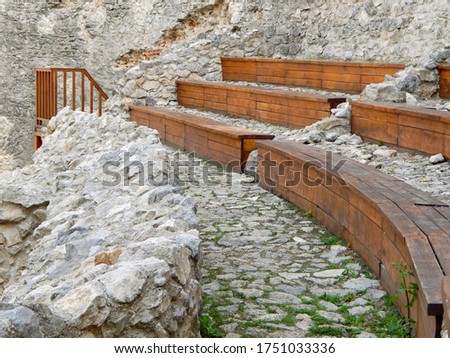 Wooden benches used for theater in the ruins of medieval castle, Topoľčany casle, Podhradie, Slovakia
