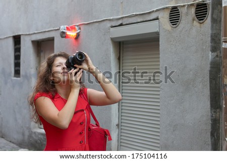 Street photographer in red dress portrait
