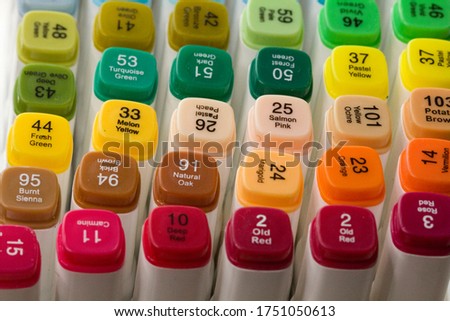 Set of bright multi-colored felt-tip pens or markers with designation of numbers and the name of color. Photo for creativity, drawing for children, design. Many Markers of all colors of the rainbow.