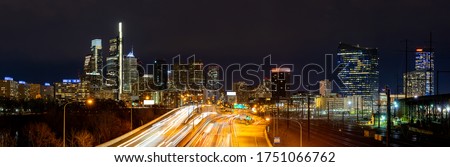 Panorama of Philadelphia skyscraper Skylines building at night illuminated with highway urban road transportation in Philly city downtown of Philadelphia in PA USA. Cityscape Urban lifstyle concept.