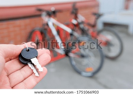 keys on the background of a bicycle. Protecting a mountain bike from theft