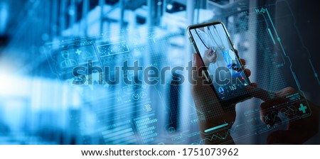 Telemedicine concept,Hand holding smartphone Medical Doctor online communicating the patient on VR medical interface with Internet consultation technology. Royalty-Free Stock Photo #1751073962
