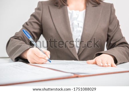 Businesswoman clerk office worker signing Documents, contract, making a deal, Office business concept