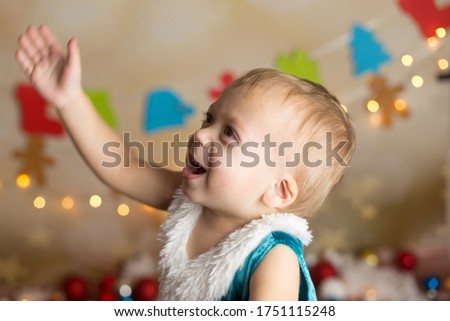 the child is happy with soap bubbles. new year's children's photos
