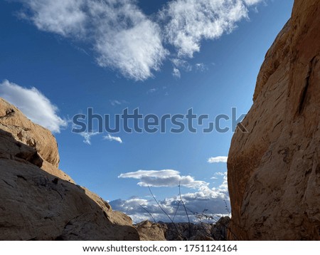 Blue sky and cloud between red rocks