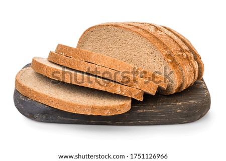 Brown bread on cutting board isolated on white