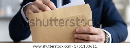 Horizontal panoramic view of businessman open envelope with postal paper letter in office, male employer or boss in formal suit get post paperwork document or correspondence at workplace