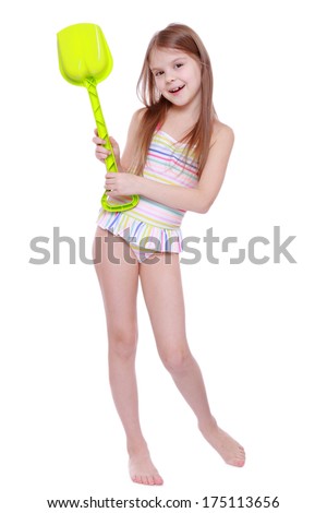 Little beautiful girl wearing pink swimsuit isolated on white background/little girl wearing swimsuit and holding children paddle