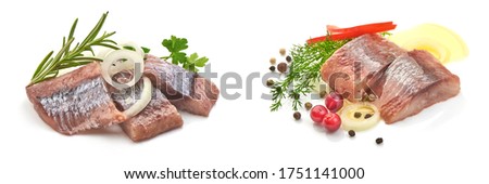 Atlantic salted herring fillet with onion ring and pepper, isolated on white background. Royalty-Free Stock Photo #1751141000