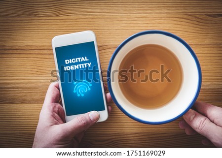 Digital identity and banking identity concept. Smart phone user with text digital identity and stylized fingerprint, symbol of unique identification and authentication, flat lay design.