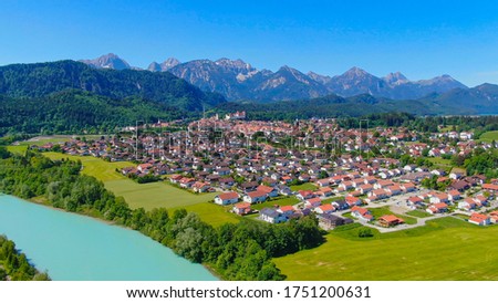 Aerial view over the city of Fuessen in Bavaria, Germany - home of the famous Bavarian King Ludwig Castles Royalty-Free Stock Photo #1751200631