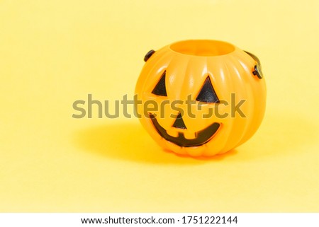 A Face of Halloween Pumpkin, Yellow Background