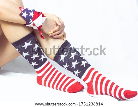 Portrait of socks with american flag stripes on white background