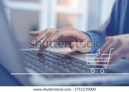 Shopping online on website or mobile application, E-commerce, digital marketing concept. Woman using  laptop computer for online shopping and internet banking via mobile apps
