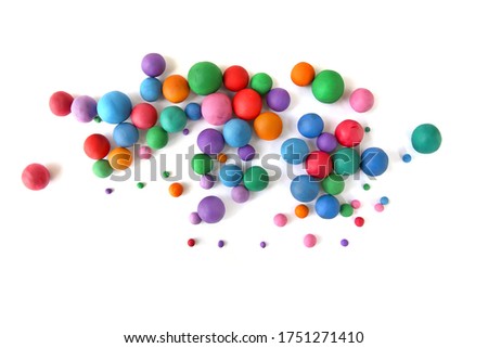 Abstract  colorful plasticine balls isolated on white background. Many balls made of modeling clay,