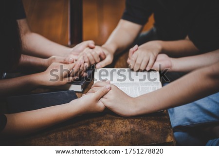 Christian family worship God in home with holy bible on wooden table Royalty-Free Stock Photo #1751278820