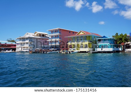 Colorful Caribbean buildings over the water with boats at dock, Colon island, Bocas del Toro, Panama Royalty-Free Stock Photo #175131416