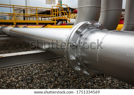 Pipe line flowing gray flange oil and bolt nut Royalty-Free Stock Photo #1751334569