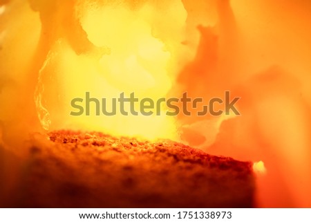 Crisp in honey creates a sensation of fire, brightly lit. Abstract background, texture, copy space