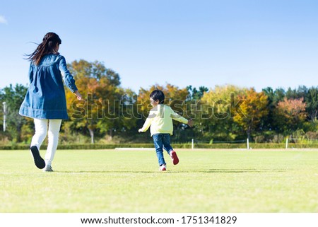Portrait of a parent and child on the lawn