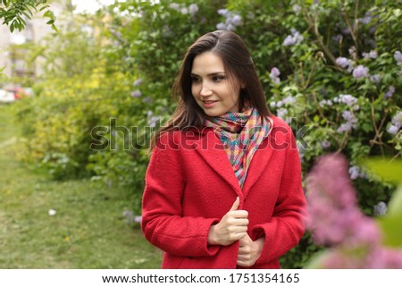 beautiful young woman with brown hair brown in a good mood positive emotions morning joy spring morning in flowering trees
