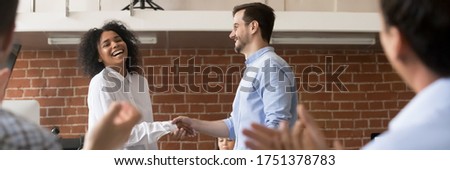 Happy ceo handshake successful african female worker corporate team clapping hands congratulating best employee of month. Getting reward or promotion. Horizontal photo banner for website header design Royalty-Free Stock Photo #1751378783