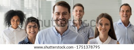 Caucasian boss company owner leader and multi ethnic employees pose for camera. Millennial business people successful staff members portrait concept. Horizontal photo banner for website header design