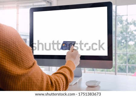 mockup Desktop computer And credit card, white space to put advertisements. Desk in the room at home Online trading via the internet 
