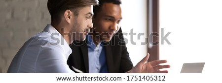Bank worker advisor consulting African client at meeting in office room. Mentor help apprentice to new employee, colleagues do common project concept. Horizontal photo banner for website header design