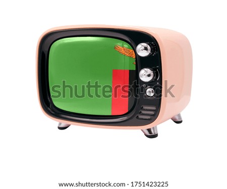 The retro old TV is isolated against a white background with the flag of Zambia