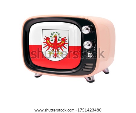 The retro old TV is isolated against a white background with the flag of Tyrol