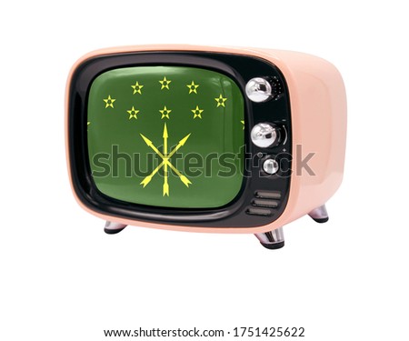 The retro old TV is isolated against a white background with the flag of Adygea