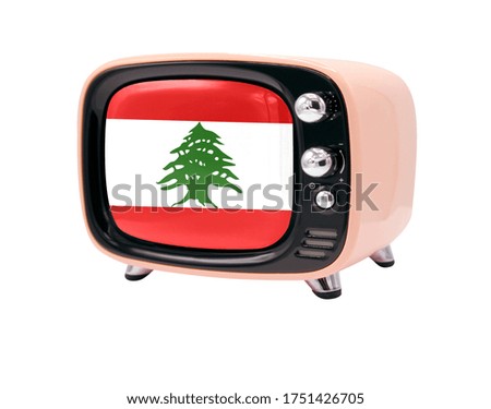The retro old TV is isolated against a white background with the flag of Lebanon