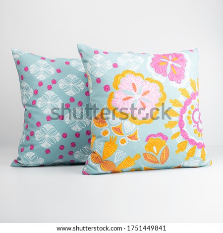 Small colored pillows for the interior on white background