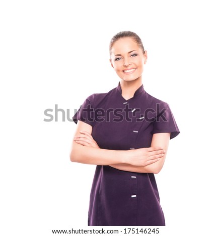 Young, happy and attractive girl in a uniform isolated on white (massage worker or sushi waiter robe) Royalty-Free Stock Photo #175146245