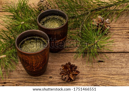 Pine needle tea, sollip-cha, traditional Korean beverage. Alternative medicine, healthy life style. Vintage wooden boards background Royalty-Free Stock Photo #1751466551
