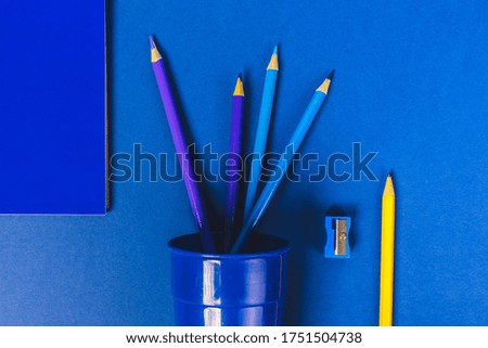school supplies on blue background