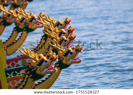Front of a dragon boat head Races the real highlight of the festival is the fierce-looking dragon boats racing in a lively, colourful spectacle.Dragon boat racing festival in Hong Kong.
