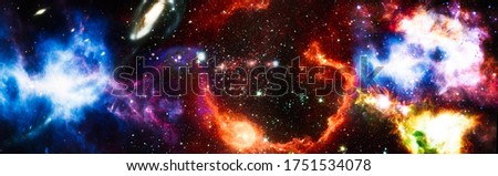 Nebula night starry sky in rainbow colors. Multicolor outer space. Star field and nebula in deep space many light years far from planet Earth. Elements of this image furnished by NASA.