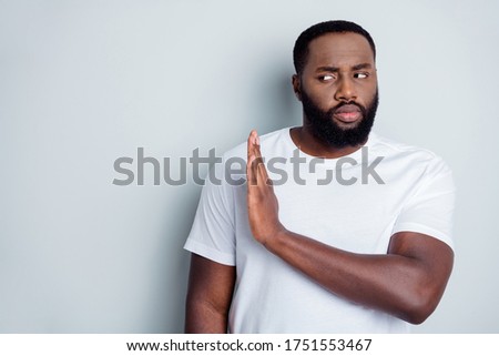 Photo of serious dark skin african guy community group member say no violence against black citizens lawlessness raise arm empty space care every human life isolated grey color background Royalty-Free Stock Photo #1751553467