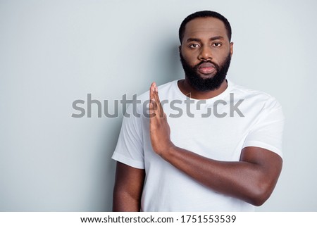 Photo of serious dark skin african citizen guy community group member say no violence behavior black lawlessness raise arm empty space care human life isolated grey color background Royalty-Free Stock Photo #1751553539