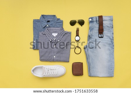 Fashion Men's clothing and accessories on yellow background ,flat lay