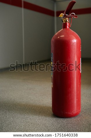red powder type industrial fire extinguisher.