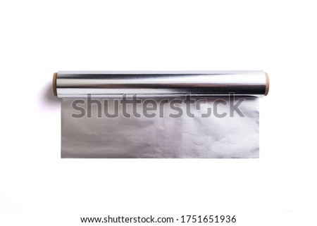 Roll of aluminium foil on white background