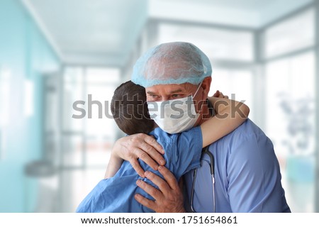 little patient is hugged by a male doctor, therapist, pediatrician, concept of medical treatment, insurance, professional care and trust, gratitude Royalty-Free Stock Photo #1751654861