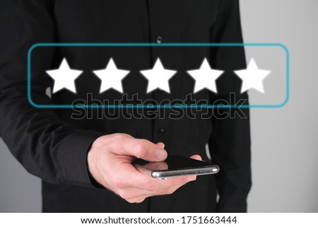 Man giving rating, leaving review with a happy face emotion icon. Product quality survey. Feedback concept.
