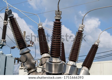 High voltage electrical insulation in a power substation, close up Royalty-Free Stock Photo #1751666393