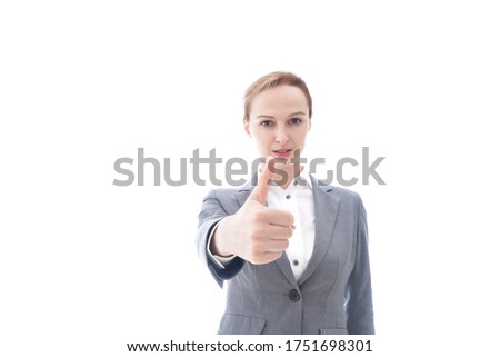 Business woman wearing a suit having Good Sign