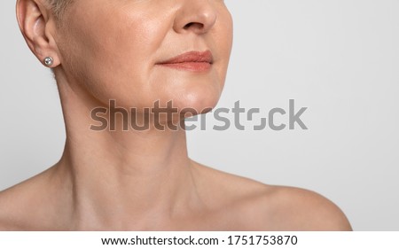Skin Lifting. Cropped image of mature woman with smooth skin over light background, closeup Royalty-Free Stock Photo #1751753870