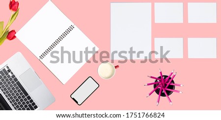 Phones, coffee cups, paper, notebooks, computers and tulips can be used as a background or for business use.  Pink background